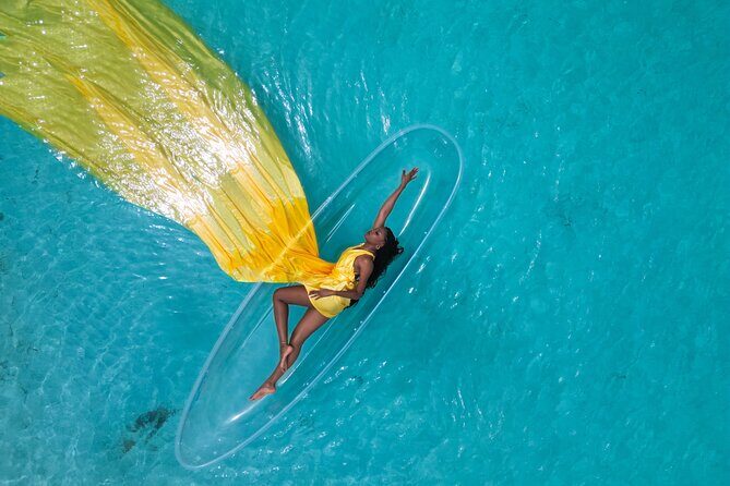 Nassau Clear Kayak Drone Photoshoot- Floating Dress - The dress “reveal” on shore: what your session really starts with